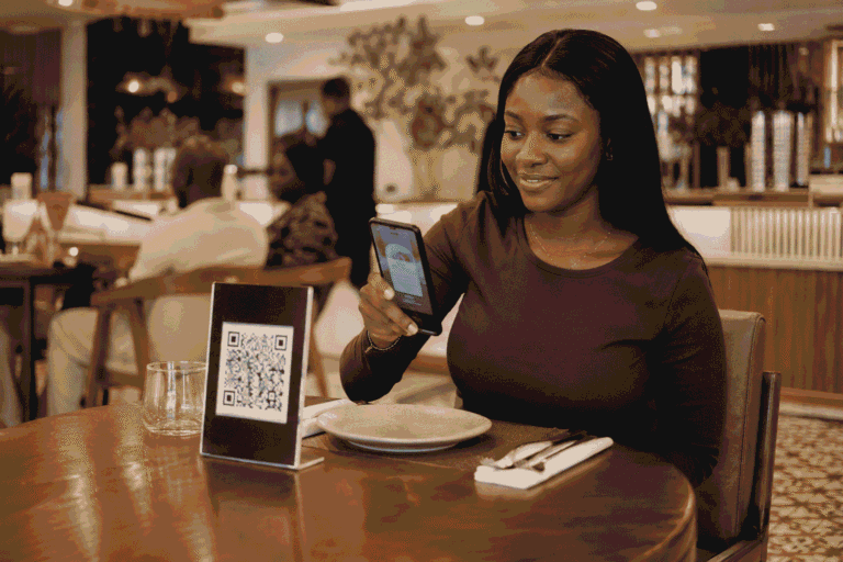 Digital menu Lagos restaurant customer scanning QR code at table 2026