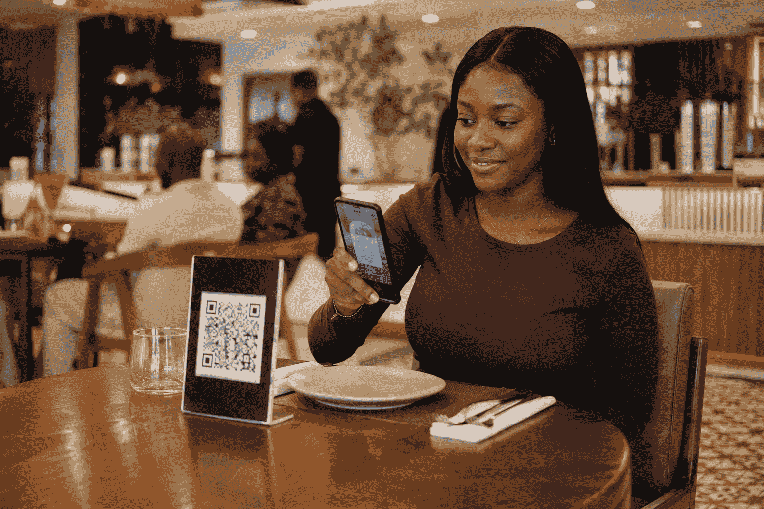 Digital menu Lagos restaurant customer scanning QR code at table 2026